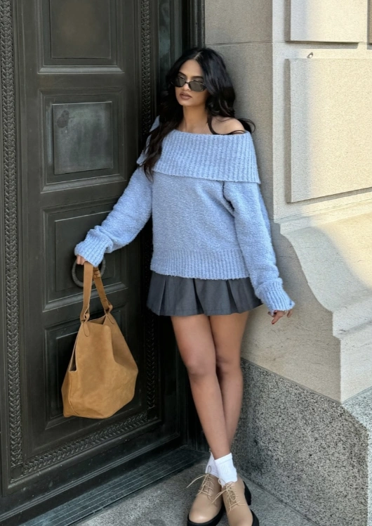 Casual grey skirt paired with a light blue off-shoulder sweater, ideal for relaxed outings or weekend brunches.
