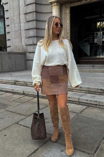 Casual brown patchwork mini skirt paired with a cozy white sweater, perfect for autumn outings or casual gatherings.