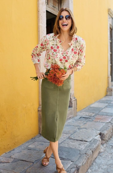 A floral-print blouse in cream and pink paired with an olive pencil skirt. Suitable for casual outings or brunch.