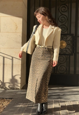 A leopard print skirt and matching jacket set, featuring a fitted style, suitable for casual outings or trendy events.