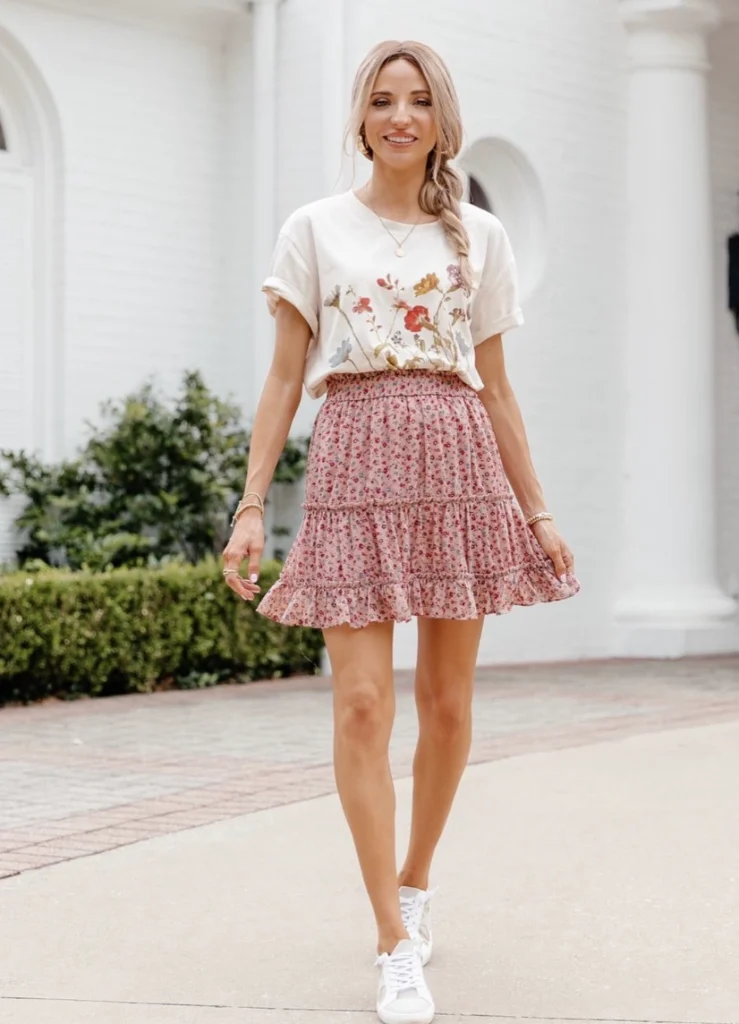 Casual floral skirt in soft pink with ruffles, paired with a cream tee featuring floral embroidery; perfect for spring outings.