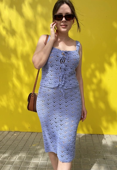 Lavender crochet midi dress featuring a fitted silhouette, spaghetti straps, and a front tie detail, perfect for casual outings.