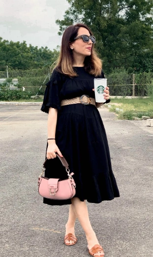 black casual maternity dress featuring ruffled sleeves, a flared skirt, and a belted waist, perfect for everyday outings.