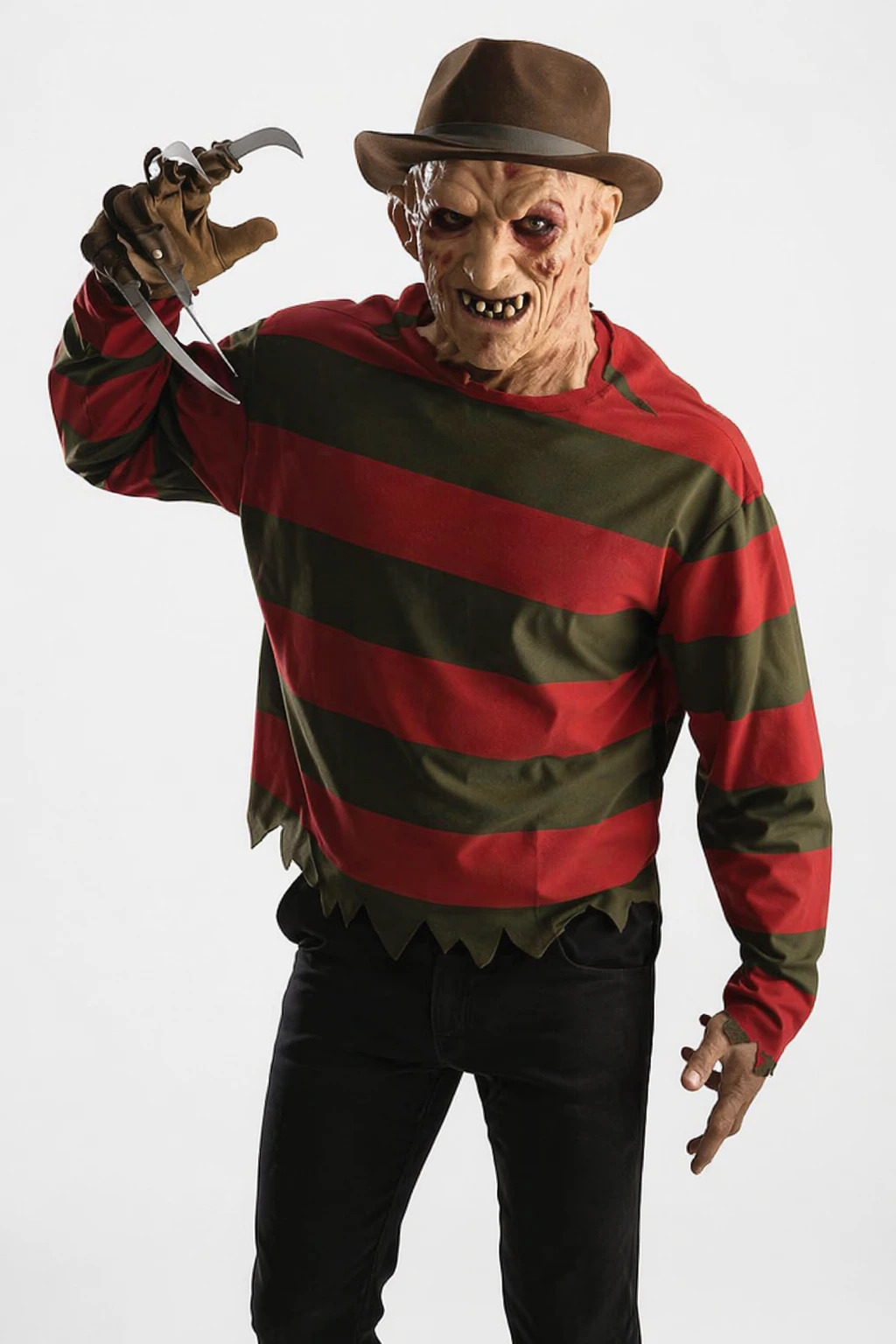 Horror costume featuring burned mask, brown fedora, striped sweater, black pants, and raised metal claw glove.