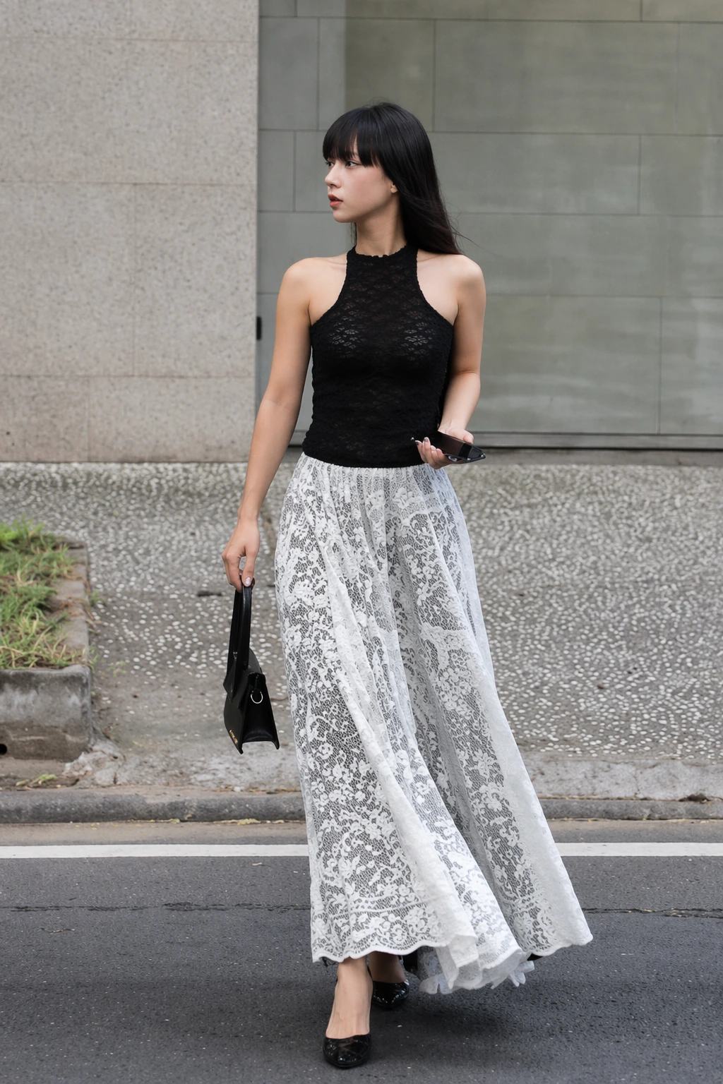Long maxi skirt with a black lace top, featuring a white floral pattern. Ideal for formal events or evening outings.