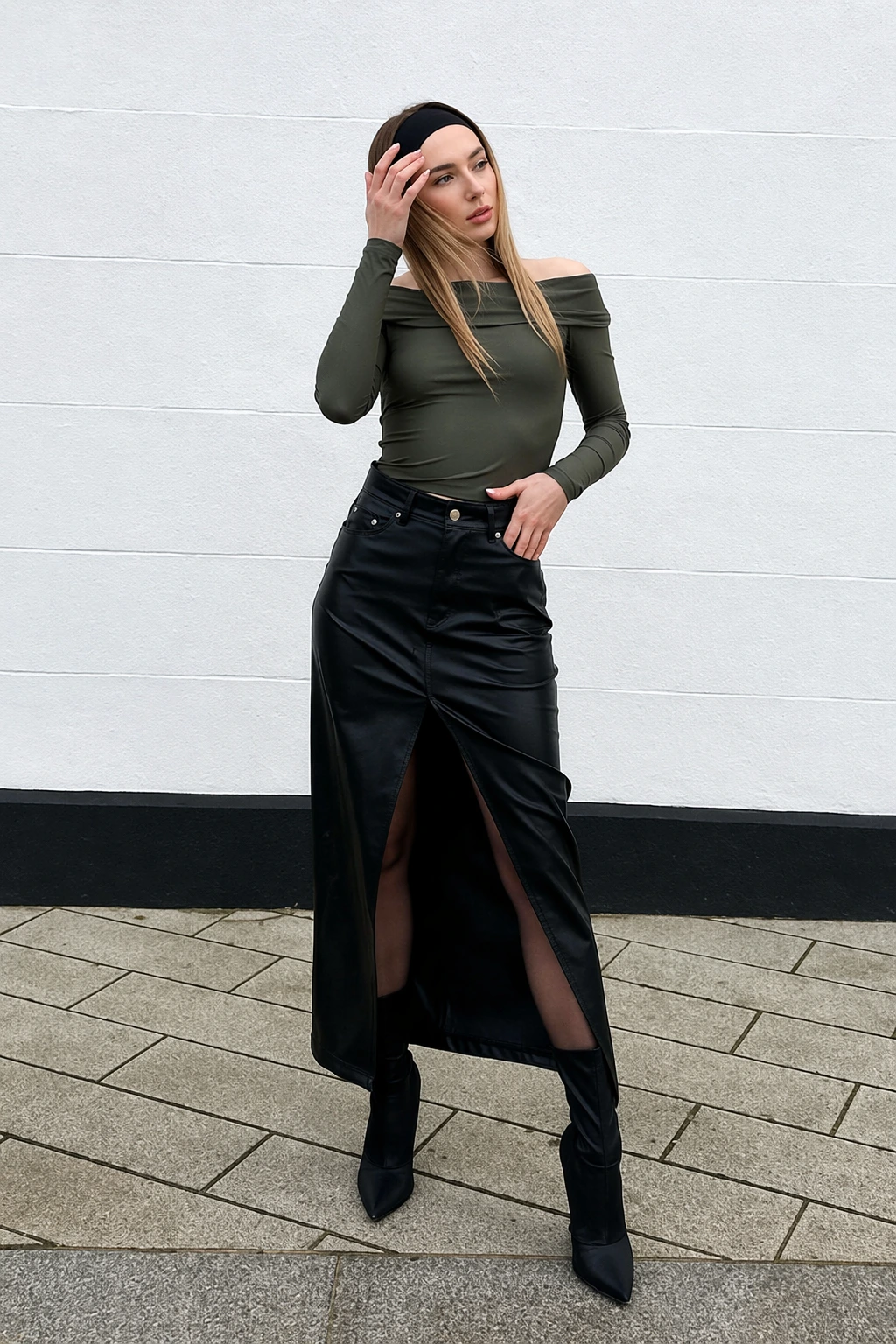 Off-shoulder olive top paired with a black, high-slit long skirt, perfect for casual or semi-formal occasions.