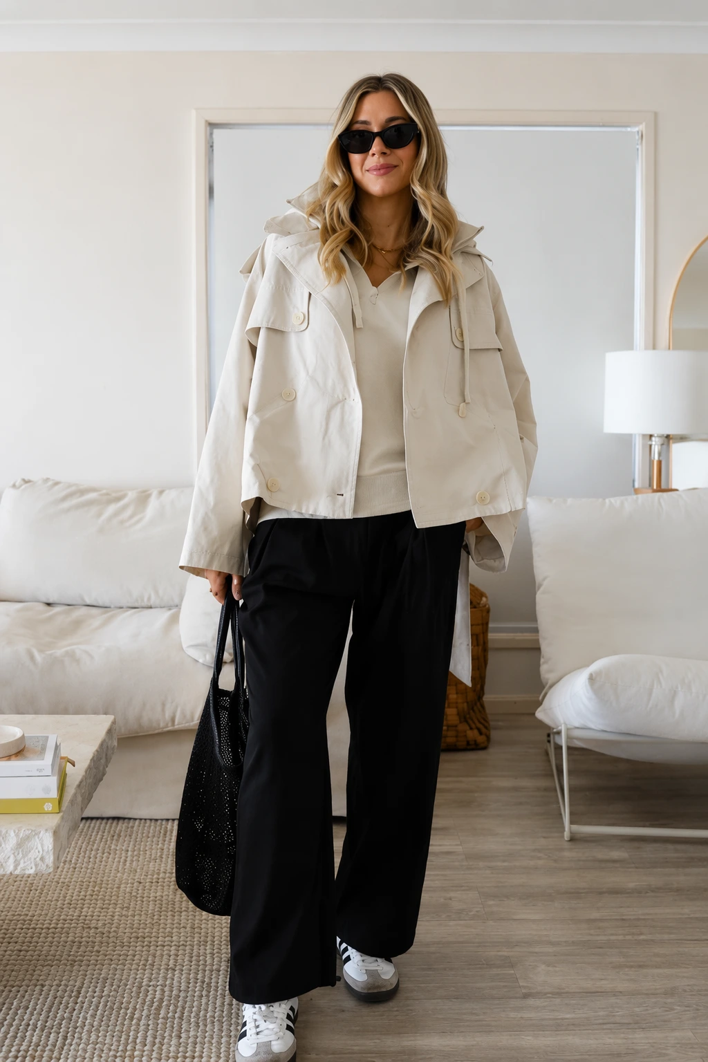 Beige oversized jacket with cream sweater and black wide-leg trousers